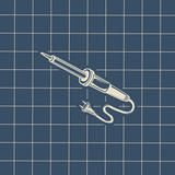 A soldering iron on a blue background.